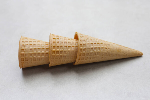 Waffle cones on grey background