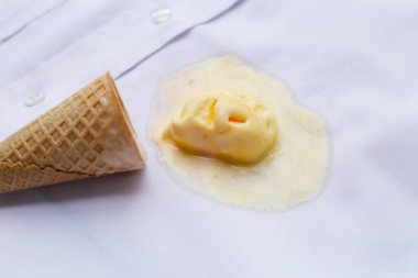 Iice cream with waffle cone on a white shirt, dirty stain clipart