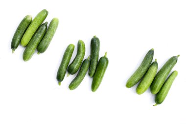 Mini cucumbers on white background. clipart