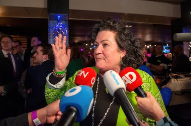 BATHMEN, THE NETHERLANDS - MAR 15, 2023: Politician Caroline van der Plas gives interviews to the press after her political party BBB wins the provincial elections. clipart