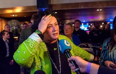 BATHMEN, THE NETHERLANDS - MAR 15, 2023: Politician Caroline van der Plas gives interviews to the press after her political party BBB wins the provincial elections. clipart