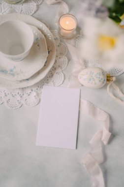 Mockup card on Elegant Breakfast Table Setting with Spring Flowers in Soft Tones clipart