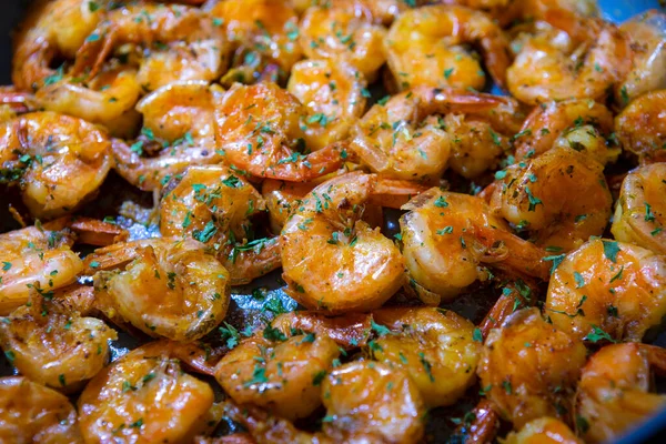 stock image Closeup image of jumbo shrimp being sauteed in a pan with oregano, chive, rosemary, garlic and paprika creating Shrimp Scampi