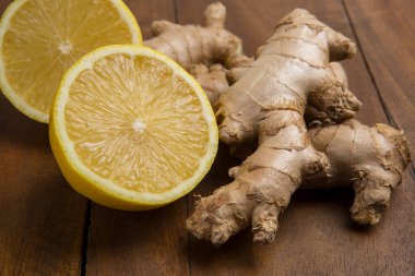 Isolated ginger and lemon pieces. Natural medicine, anti-flu ingredients