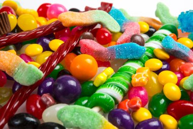  Multicolored assortment of candies. Background of sweets and lollipops and colorful array of different treats 