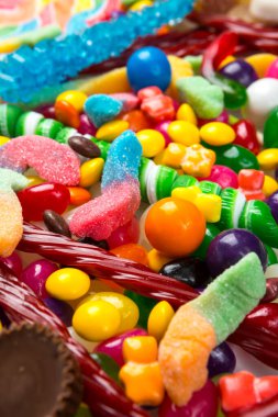  Multicolored assortment of candies. Background of sweets and lollipops and colorful array of different treats 
