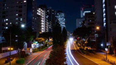 A night timelapse of the traffic jam at the city crossing in Tokyo. High quality 4k footage. Nakano district Higashinakano Tokyo Japan 10.11.2022 Here is an electric quarter in Tokyo. It is center of