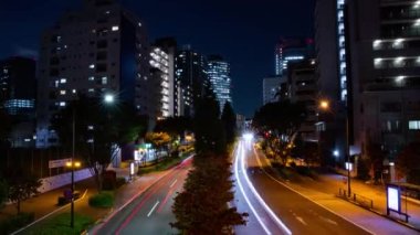 A night timelapse of the traffic jam at the city crossing in Tokyo. High quality 4k footage. Nakano district Higashinakano Tokyo Japan 10.11.2022 Here is an electric quarter in Tokyo. It is center of