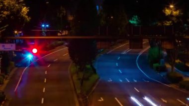 A night timelapse of the traffic jam at the city crossing in Tokyo. High quality 4k footage. Nakano district Higashinakano Tokyo Japan 10.11.2022 Here is an electric quarter in Tokyo. It is center of