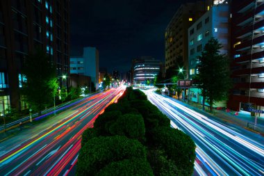 A night traffic jam at the downtown street in Tokyo wide shot. High quality photo. Toshima district Mejiro Tokyo Japan 10.27.2022 Here is a city street in Tokyo. 