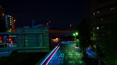 A night timelapse of the traffic jam at the downtown street in Tokyo. High quality 4k footage. Toshima district Mejiro Tokyo Japan 10.27.2022 Here is a city street in Tokyo. 