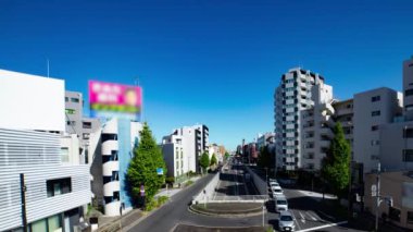 A timelapse of the traffic jam at the crossing in Tokyo wide shot. Setagaya district Tokyo Japan 11.02.2022 Here is a downtown district in Tokyo. High quality 4k footage.