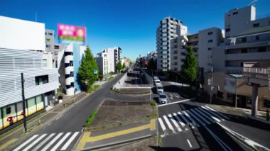 A timelapse of the traffic jam at the crossing in Tokyo wide shot. Setagaya district Tokyo Japan 11.02.2022 Here is a downtown district in Tokyo. High quality 4k footage.