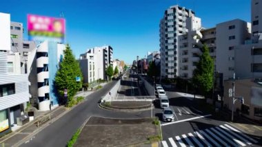 A timelapse of the traffic jam at the crossing in Tokyo wide shot. Setagaya district Tokyo Japan 11.02.2022 Here is a downtown district in Tokyo. High quality 4k footage.