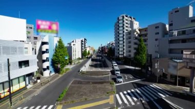 A timelapse of the traffic jam at the crossing in Tokyo wide shot. Setagaya district Tokyo Japan 11.02.2022 Here is a downtown district in Tokyo. High quality 4k footage.