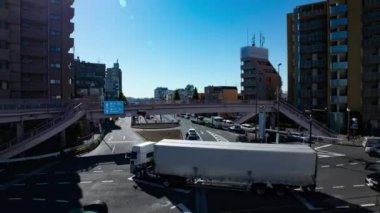 A timelapse of the traffic jam at the crossing in Tokyo wide shot. Setagaya district Tokyo Japan 11.02.2022 Here is a downtown district in Tokyo. High quality 4k footage.