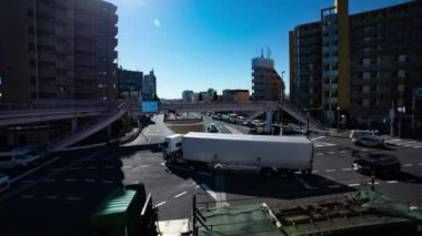 A timelapse of the traffic jam at the crossing in Tokyo wide shot. Setagaya district Tokyo Japan 11.02.2022 Here is a downtown district in Tokyo. High quality 4k footage.