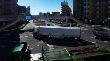 A timelapse of the traffic jam at the crossing in Tokyo wide shot. Setagaya district Tokyo Japan 11.02.2022 Here is a downtown district in Tokyo. High quality 4k footage.