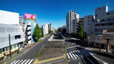 A timelapse of the traffic jam at the crossing in Tokyo wide shot. Setagaya district Tokyo Japan 11.02.2022 Here is a downtown district in Tokyo. High quality 4k footage.