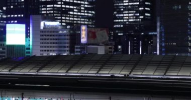 A night cityscape in Marunouchi Tokyo high angle long shot. High quality 4k footage. Chiyoda district Marunouchi Tokyo Japan 09.13.2022 It is center of the city in Tokyo. 