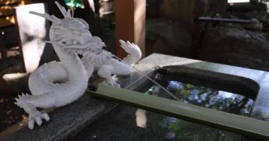 A traditional landscape at Tanashi Shrine in Tokyo. Nishitokyo district Tanashi Tokyo Japan 10.20.2022 This is a chozuya. Its a place where you wash your hands and rinse your mouth at a shrine. High