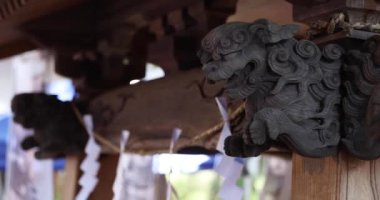 A traditional landscape at Tanashi Shrine in Tokyo. Nishitokyo district Tanashi Tokyo Japan 10.20.2022 This statue is called Komainu. High quality 4k footage