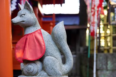 A statue of fox at Japanese Shrine. High quality photo. Nishitokyo district Tanashi Tokyo Japan 10.20.2022 This statue is called Oinarisan. 