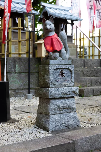 A statue of fox at Japanese Shrine. High quality photo. Nishitokyo district Tanashi Tokyo Japan 10.20.2022 This statue is called Oinarisan.