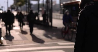 A slow motion of walking people on the street in the city. High quality 4k footage. Chuo district Tokyo Japan 01.18.2023 Here is an electric quarter in Tokyo. It is center of the city in Tokyo. 