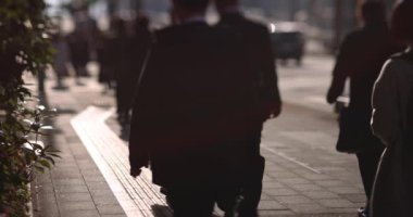 A slow motion of walking people on the street in the city. High quality 4k footage. Chuo district Tokyo Japan 01.18.2023 Here is an electric quarter in Tokyo. It is center of the city in Tokyo. 