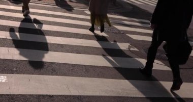 A slow motion of walking people on the street in the city. High quality 4k footage. Chuo district Tokyo Japan 01.18.2023 Here is an electric quarter in Tokyo. It is center of the city in Tokyo. 