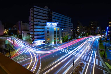 A night timelapse of traffic jam at Yamate avenue in Tokyo wide shot. High quality photo. Meguro district Ohashi Tokyo Japan - 02.09.2023 It is neon street at the urban city. 