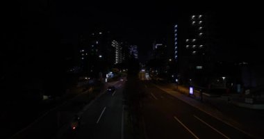 Tokyo 'da bir gece trafiği sıkışıklığı. Yüksek kalite 4K görüntü. Nakano Bölgesi Higashinakano Tokyo Japonya 10.11.2022 Tokyo 'da bir elektrik çeyreği. Evet, öyle. Yüksek kalite 4k görüntü