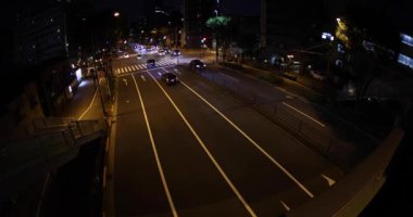 A night traffic jam at the city crossing in Tokyo. High quality 4k footage. Nakano district Higashinakano Tokyo Japan 10.11.2022 Here is an electric quarter in Tokyo. It is. High quality 4k footage