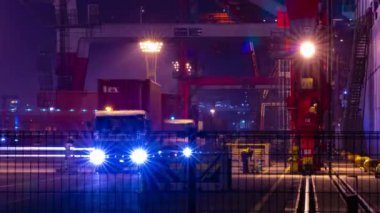 A night timelapse of crane near the container port in Aomi Tokyo. High quality 4k footage. Koto district Aomi Tokyo Japan 01.13.2023 It is a container port in Tokyo. 