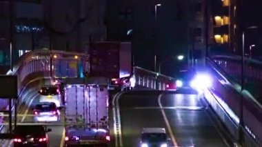 Tokyo 'daki şehir caddesindeki trafik sıkışıklığının gece zamanı. Yüksek kalite 4K görüntü. Setagaya bölgesi Tokyo 05.08.2023 Tokyo 'nun merkezidir.. 