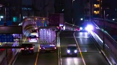 Tokyo 'daki şehir caddesindeki trafik sıkışıklığının gece zamanı. Yüksek kalite 4K görüntü. Setagaya bölgesi Tokyo 05.08.2023 Tokyo 'nun merkezidir.. 