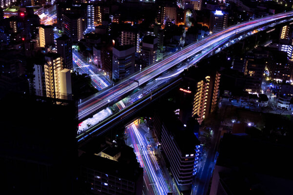 A night cityscape at the highway in Osaka telephoto shot. High quality photo. Asahi district Osaka Japan 04.09.2023 Here is near the well known river in Osaka.
