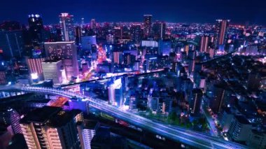 Osaka yüksek açılı geniş açılı panoramik şehir manzarasının gece zaman çizelgesi. Yüksek kalite 4K görüntü. Asahi Bölgesi Osaka Japonya 04.10.2023 Burası Osaka 'daki Takarazuka Demiryolu yakınında.. 