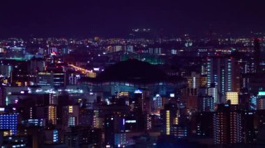 Osaka 'daki Kyocera kubbesi yakınlarındaki bir şehir manzarasının gece çekimleri. Yüksek kalite 4K görüntü. Asahi Bölgesi Osaka Japonya 04.10.2023 Burası Osaka 'daki Takarazuka Demiryolu yakınında.. 