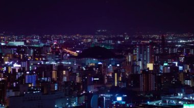 Osaka 'daki Kyocera kubbesi yakınlarındaki bir şehir manzarasının gece çekimleri. Yüksek kalite 4K görüntü. Asahi Bölgesi Osaka Japonya 04.10.2023 Burası Osaka 'daki Takarazuka Demiryolu yakınında.. 