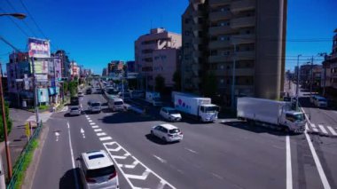 Tokyo 'daki Mejiro Bulvarı' ndaki şehir merkezinde trafik sıkışıklığı zamanı. Yüksek kalite 4K görüntü. Nerima Bölgesi Yahara Tokyo Japonya 09.05.2023