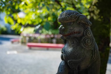 A statue of guardian dog KOMAINU at Nanasha shrine in Tokyo. High quality photo. Kita district Nishigawara Tokyo Japan 10.11.2024 It is a landscape of Japanese shrine in Tokyo.  clipart