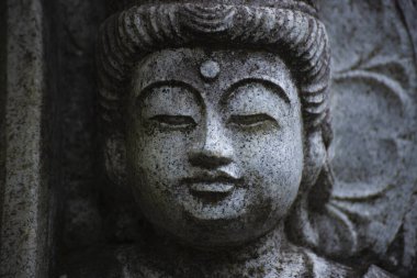 A buddhism stone statue at Japanese temple. High quality photo. Higashimurayama district Tokyo Japan 11.14.2024 It is a religious stone statue in Japanese temple. clipart