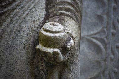 A buddhism stone statue at Japanese temple. High quality photo. Higashimurayama district Tokyo Japan 11.14.2024 It is a religious stone statue in Japanese temple. clipart