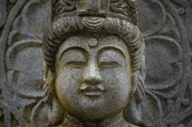 A buddhism stone statue at Japanese temple. High quality photo. Higashimurayama district Tokyo Japan 11.14.2024 It is a religious stone statue in Japanese temple. clipart