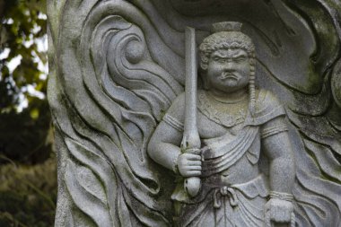 A buddhism stone statue at Japanese temple. High quality photo. Higashimurayama district Tokyo Japan 11.14.2024 It is a religious stone statue in Japanese temple. clipart