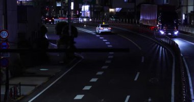 A night cityscape of the traffic jam at the downtown street in Tokyo. High quality 4k footage. Setagaya district Tokyo Japan 05.08.2023 This street is called Kannana avenue in Tokyo. 