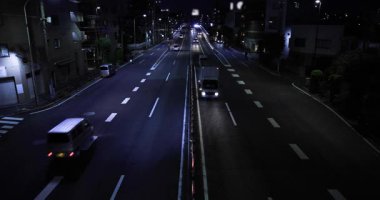 Tokyo şehir merkezindeki trafik sıkışıklığının gece manzarası. Yüksek kalite 4K görüntü. Setagaya bölgesi Tokyo 05.08.2023 Tokyo 'da bu caddeye Kannana Bulvarı denir.. 