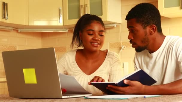 African American Couple Managing Finances Bank Using Laptop Kitchen — Stock Video